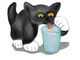 Tuxedo Kitten Sneaks a Glass of Milk